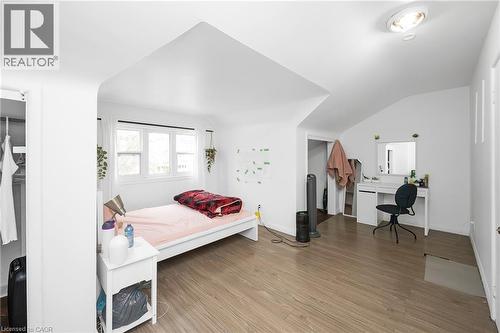 Bedroom with an office area, wood finished floors, and lofted ceiling - 43 Sterling Street, Hamilton, ON - Indoor Photo Showing Bedroom