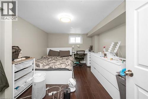 Bedroom featuring an office area and dark wood-style floors - 43 Sterling Street, Hamilton, ON - Indoor Photo Showing Bedroom