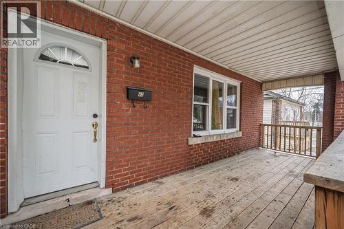 Entrance to property with brick siding and covered porch - 43 Sterling Street, Hamilton, ON - Outdoor With Exterior