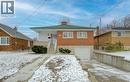 View of front of home featuring a chimney, an attached garage, driveway, brick siding, and a porch - 171 Sixth Avenue, Kitchener, ON  - Outdoor 