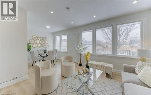 Living area featuring light wood-style floors and recessed lighting - 171 Sixth Avenue, Kitchener, ON - Indoor