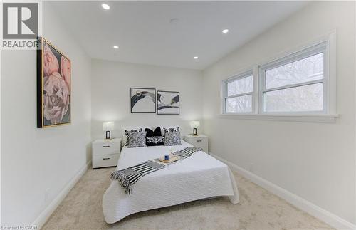 Bedroom featuring light carpet and recessed lighting - 171 Sixth Avenue, Kitchener, ON - Indoor Photo Showing Bedroom