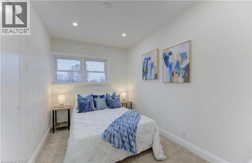 Bedroom featuring light colored carpet and recessed lighting - 171 Sixth Avenue, Kitchener, ON - Indoor Photo Showing Bedroom