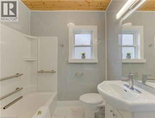 Bathroom featuring vanity, wooden ceiling, and tub / shower combination - 171 Sixth Avenue, Kitchener, ON - Indoor Photo Showing Bathroom