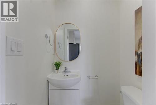 Half bath featuring toilet and a sink - 171 Sixth Avenue, Kitchener, ON - Indoor Photo Showing Bathroom