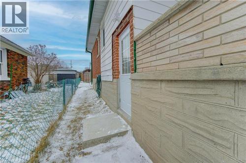 Snow covered property featuring an outdoor structure - 171 Sixth Avenue, Kitchener, ON - Outdoor