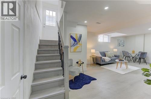 Staircase with wood finished floors and recessed lighting - 171 Sixth Avenue, Kitchener, ON - Indoor