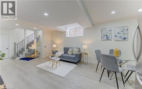 Living room with light wood-style floors and recessed lighting - 171 Sixth Avenue, Kitchener, ON - Indoor