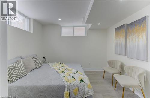 Bedroom featuring recessed lighting, light wood finished floors, and multiple windows - 171 Sixth Avenue, Kitchener, ON - Indoor