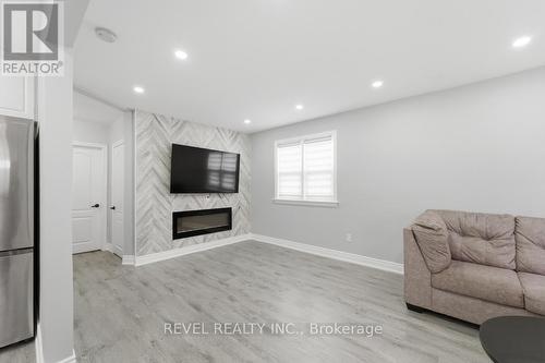 44 Jefferson Avenue, Hamilton, ON - Indoor Photo Showing Other Room With Fireplace