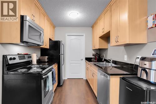 304F 1121 Mckercher Drive, Saskatoon, SK - Indoor Photo Showing Kitchen With Stainless Steel Kitchen With Double Sink