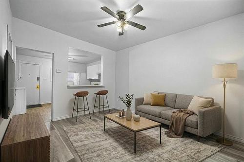 Virtually staged for design and layout inspiration. - 401 Union Avenue W, Winnipeg, MB - Indoor Photo Showing Living Room