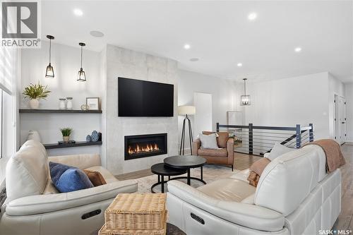 4418 Sage Crescent E, Regina, SK - Indoor Photo Showing Living Room With Fireplace