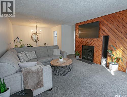 A 22 Nollet Avenue, Regina, SK - Indoor Photo Showing Living Room With Fireplace