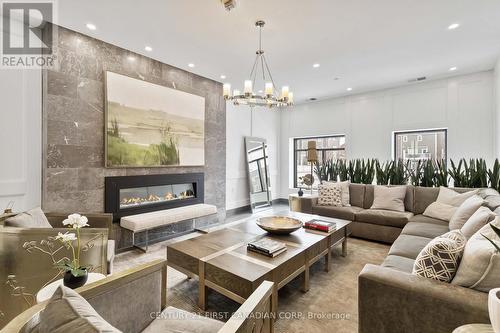 Lobby - 411 - 260 Villagewalk Boulevard, London North (North R), ON - Indoor Photo Showing Living Room With Fireplace