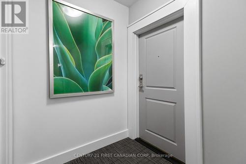 Front door of #411 - 411 - 260 Villagewalk Boulevard, London North (North R), ON - Indoor Photo Showing Other Room