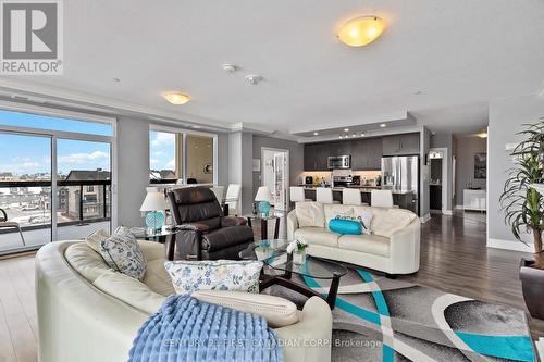 Living/dining room - NW facing - 411 - 260 Villagewalk Boulevard, London North (North R), ON - Indoor Photo Showing Living Room