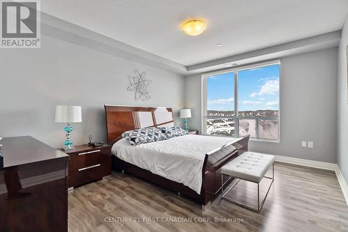 Primary - 411 - 260 Villagewalk Boulevard, London North (North R), ON - Indoor Photo Showing Bedroom