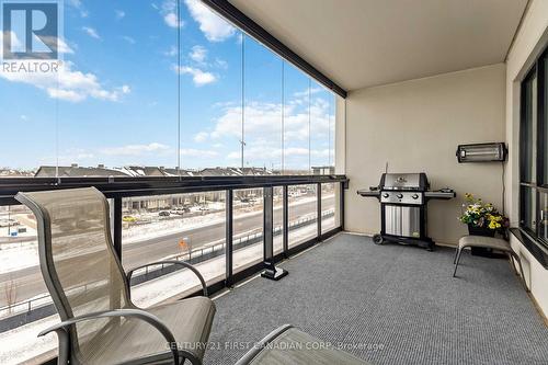 Enclosed balcony - NW facing - glass panels - 411 - 260 Villagewalk Boulevard, London North (North R), ON - Outdoor With Balcony With Exterior