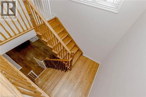 Stairway with wood finished floors - 2 Doon Creek Street, Kitchener, ON - Indoor Photo Showing Other Room