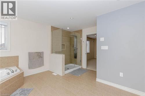 Full bath featuring a stall shower, a garden tub, and recessed lighting - 2 Doon Creek Street, Kitchener, ON - Indoor Photo Showing Bathroom