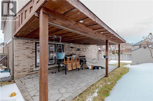 Snow covered patio with a patio and grilling area - 2 Doon Creek Street, Kitchener, ON - Outdoor