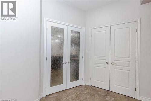 Entryway with french doors and baseboards - 2 Doon Creek Street, Kitchener, ON - Indoor Photo Showing Other Room