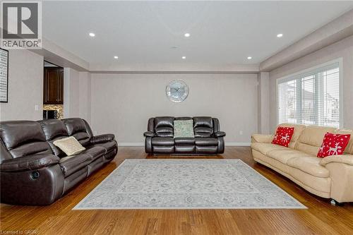 Living area with wood finished floors and recessed lighting - 2 Doon Creek Street, Kitchener, ON - Indoor Photo Showing Living Room