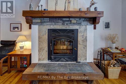 Zero Clearance Wood Fireplace - 397 Silver Birch Drive, Tiny, ON - Indoor Photo Showing Living Room With Fireplace