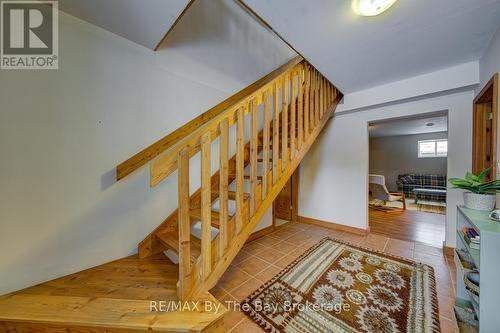 Stairs to Lower Level - 397 Silver Birch Drive, Tiny, ON - Indoor Photo Showing Other Room