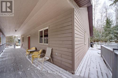 Porch wraps around 3 Sides - 397 Silver Birch Drive, Tiny, ON - Outdoor With Deck Patio Veranda With Exterior