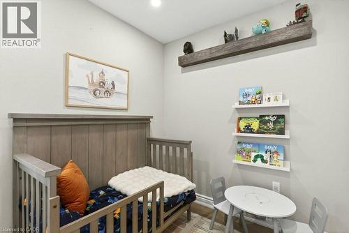 Bedroom with a nursery area and wood finished floors - 237 East 32Nd Street, Hamilton, ON - Indoor