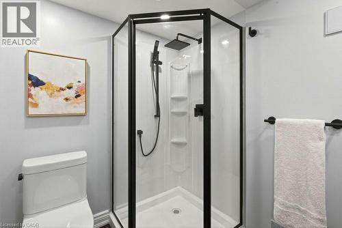 Full bathroom featuring a shower stall and toilet - 237 East 32Nd Street, Hamilton, ON - Indoor Photo Showing Bathroom