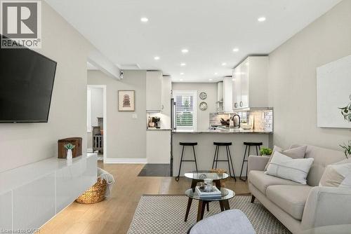 Living room featuring light wood-style floors and recessed lighting - 237 East 32Nd Street, Hamilton, ON - Indoor Photo Showing Living Room