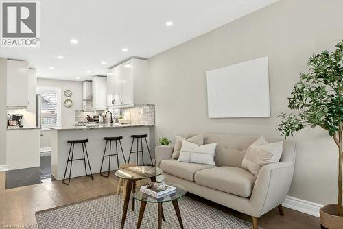 Living room with dark wood-style floors and recessed lighting - 237 East 32Nd Street, Hamilton, ON - Indoor Photo Showing Living Room