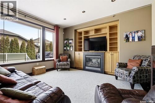 2451 Linner Bay, Regina, SK - Indoor Photo Showing Living Room With Fireplace