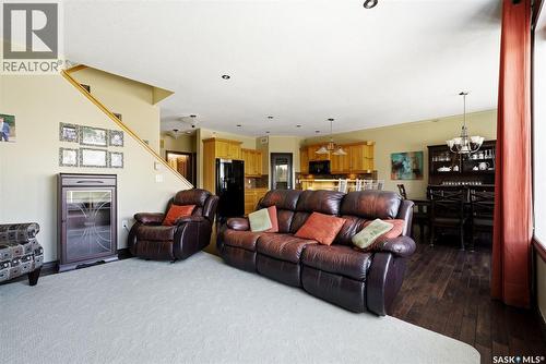 2451 Linner Bay, Regina, SK - Indoor Photo Showing Living Room With Fireplace