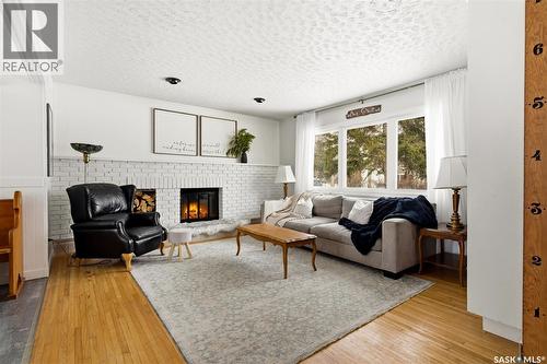 18 Marsh Crescent, Regina, SK - Indoor Photo Showing Living Room With Fireplace