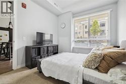 Carpeted bedroom with baseboards - 