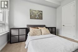 Bedroom with light carpet and baseboards - 