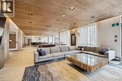 Living room featuring wood ceiling and light wood finished floors - 