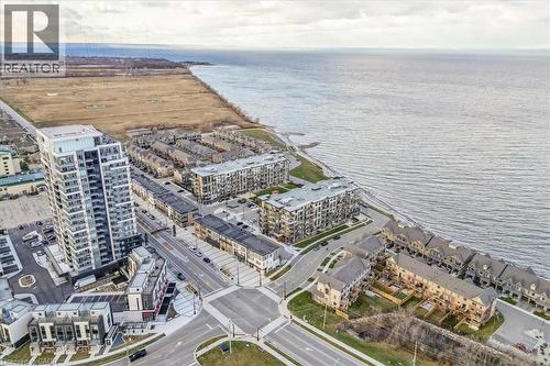 View of urban area with a nearby body of water and apartment complex - 40 Esplanade Lane Unit# 102, Grimsby, ON - Outdoor With Body Of Water With View