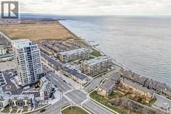 View of urban area with a nearby body of water and apartment complex - 