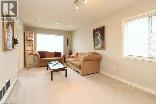 Living room featuring light carpet and recessed lighting - 142 Hawkswood Trail, Hamilton, ON - Indoor Photo Showing Other Room