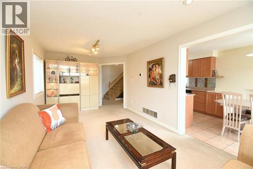 Living room with light carpet and stairway - 142 Hawkswood Trail, Hamilton, ON - Indoor Photo Showing Living Room
