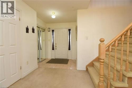 Foyer featuring light carpet and light tile patterned floors - 142 Hawkswood Trail, Hamilton, ON - Indoor Photo Showing Other Room