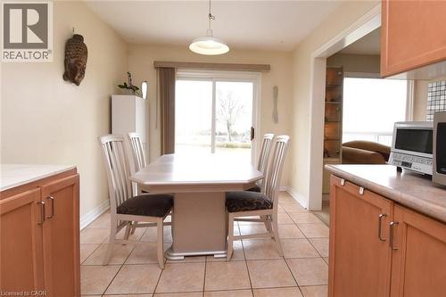 Dining room with light tile patterned floors and baseboards - 142 Hawkswood Trail, Hamilton, ON - Indoor