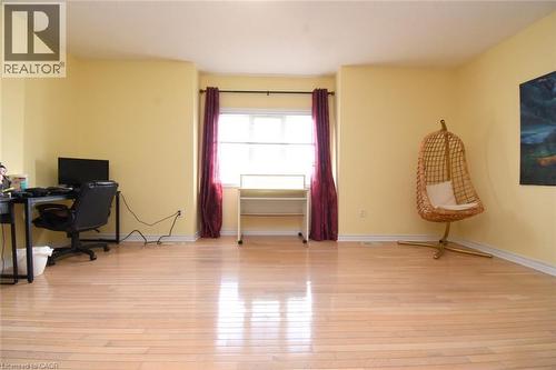 Home office featuring light wood-style flooring and baseboards - 142 Hawkswood Trail, Hamilton, ON - Indoor