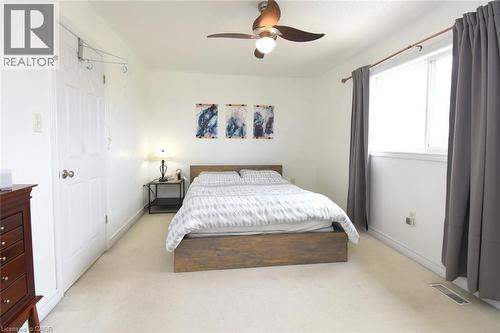 Bedroom with light colored carpet and ceiling fan - 142 Hawkswood Trail, Hamilton, ON - Indoor Photo Showing Bedroom