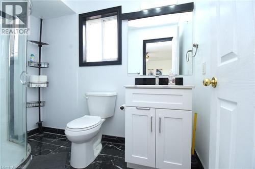 Bathroom featuring a shower stall, vanity, and dark marble finish flooring - 142 Hawkswood Trail, Hamilton, ON - Indoor Photo Showing Bathroom